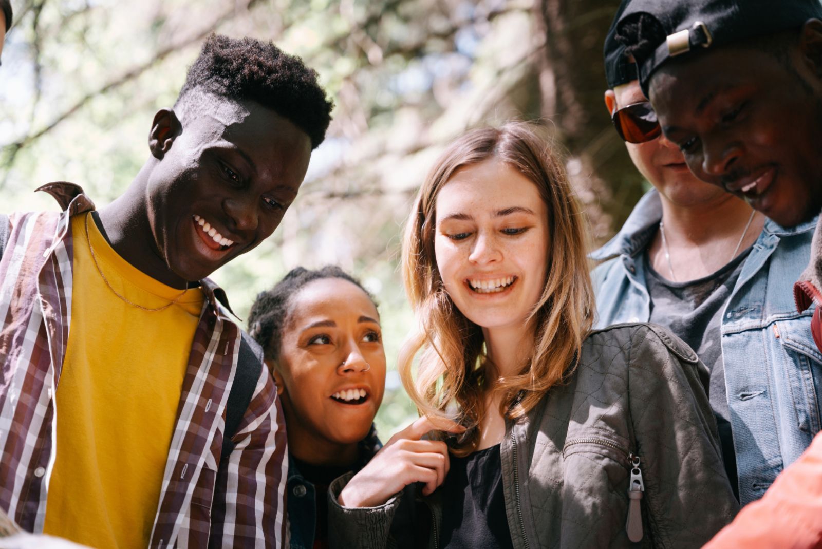 A diverse group of young friends gathered together, smiling